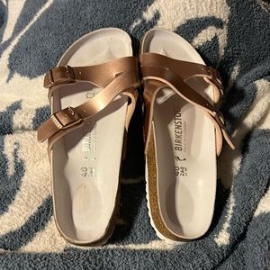 Beautiful rose gold birkenstock sandals. Never been worn!!
